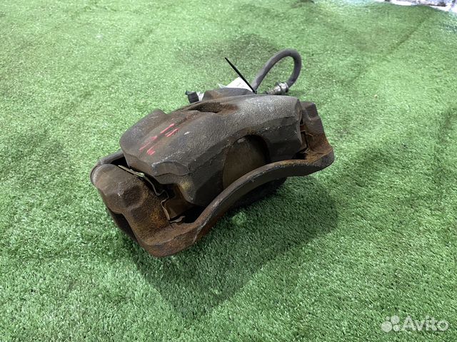 Тормозной суппорт передний левый Nissan Qashqai