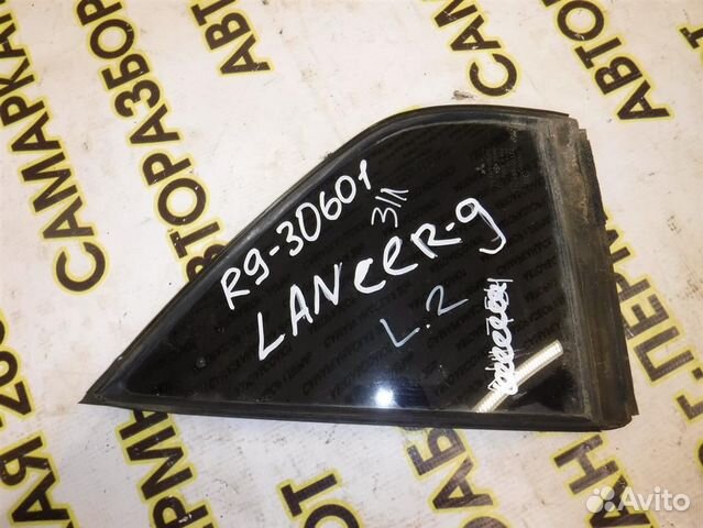 Стекло двери задней левой (форточка) Mitsubishi L